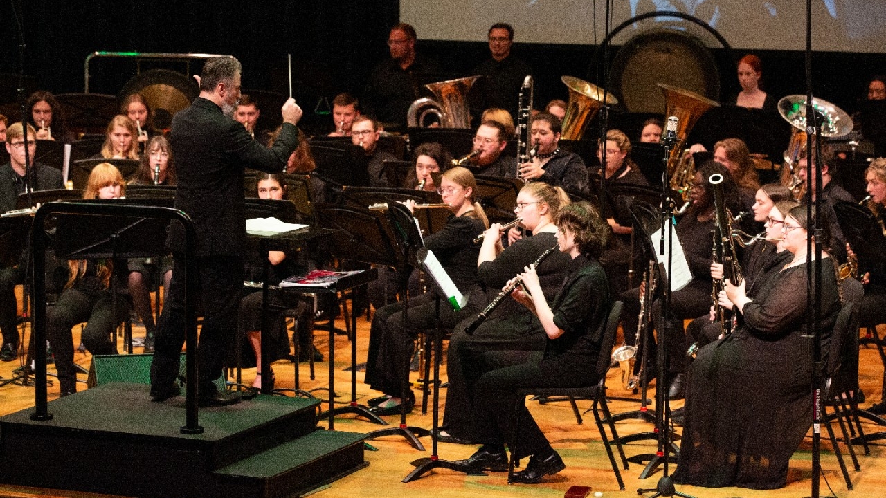 Wind band performing on stage