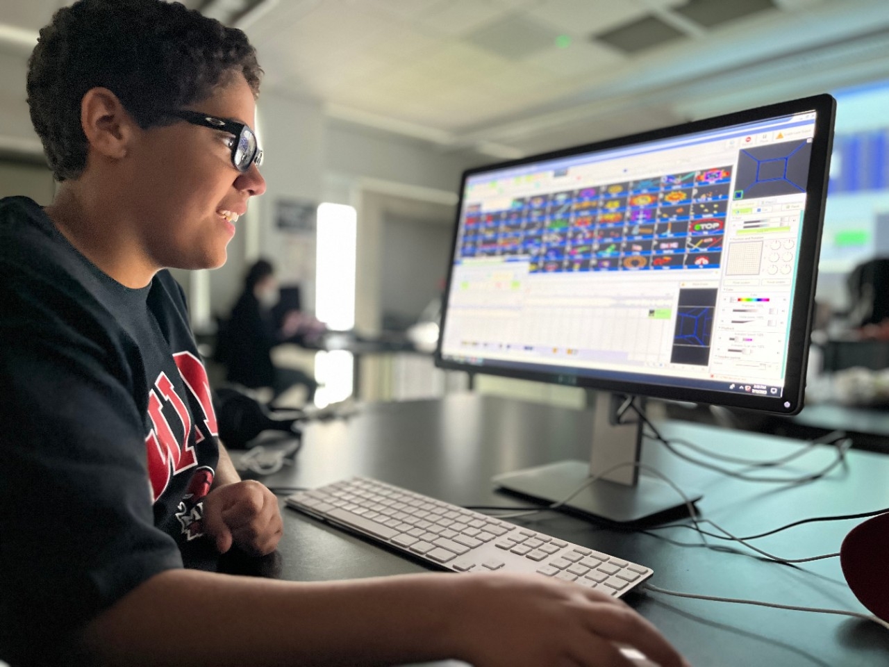 Campers crafting custom light shows on computers