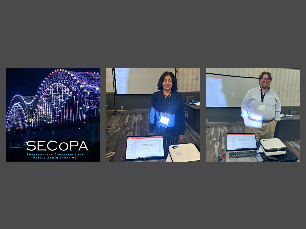 Untitled design - 1 Drs. Ahmed and Wilson standing in room for presentations