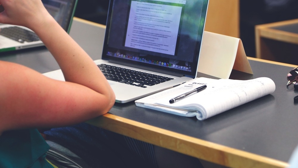 a close-up of a person using a laptop computer