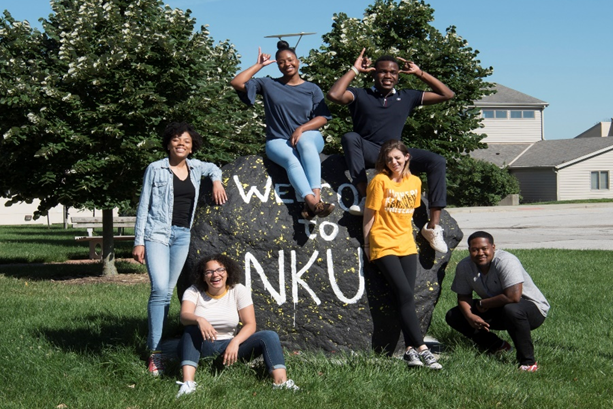 students gather around NKU rock